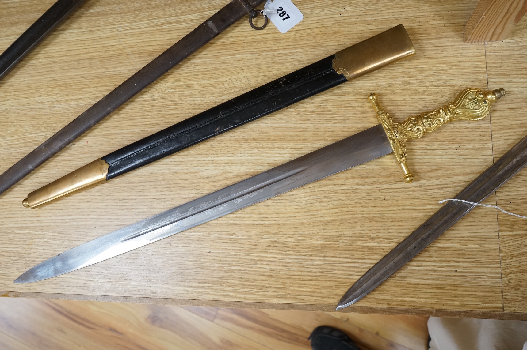 A Scottish sidearm for the King’s Own Bodyguard for Scotland, straight blade by J. Stewart and Son, etched and polished regulation blade, ormolu hilt, in its leather scabbard with ormolu mounts (gilding worn to mounts)